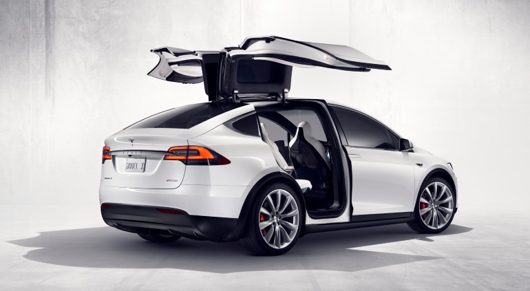 An electric car with gull-wing doors.